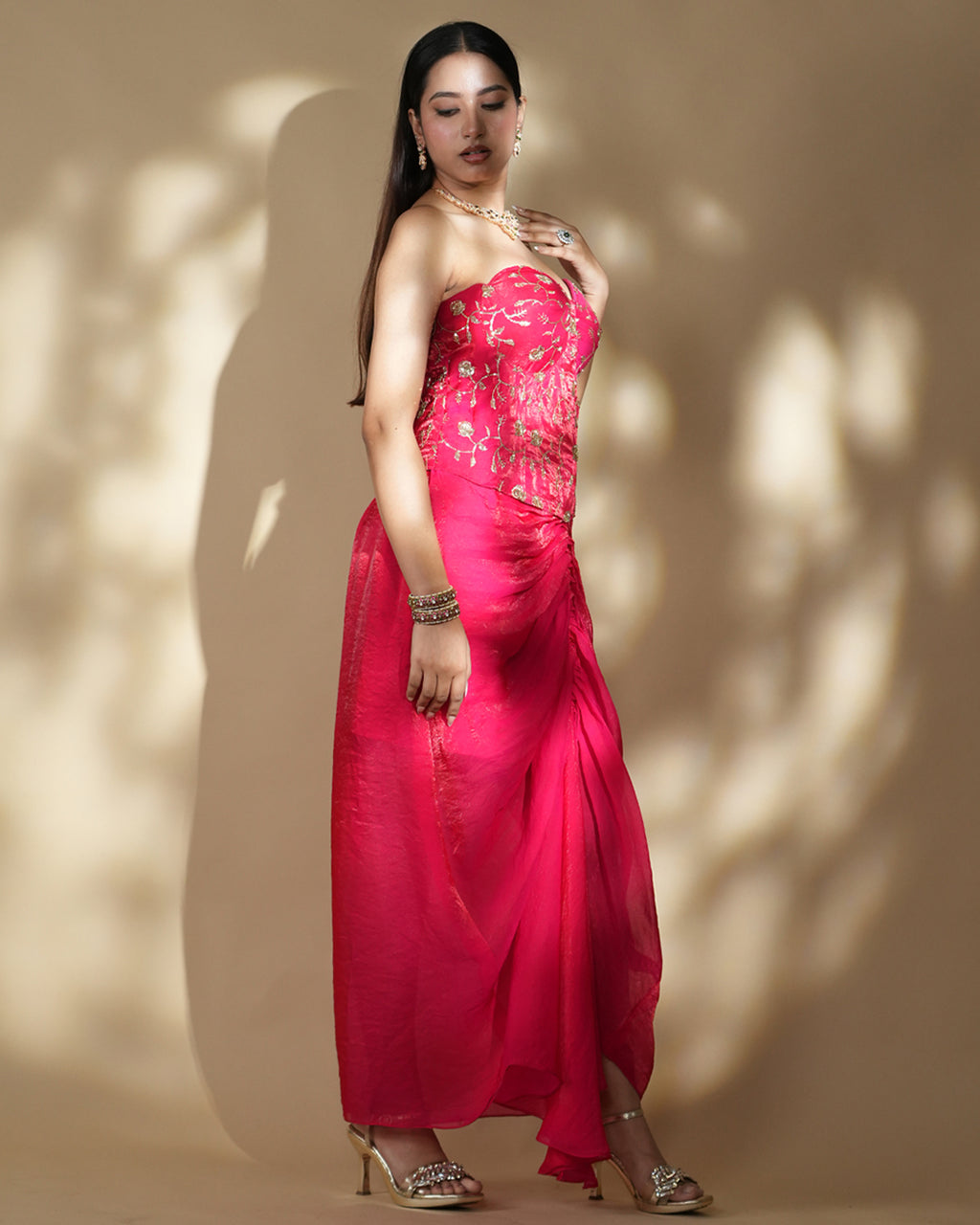 Hot pink corset gown with gold embroidered detailing