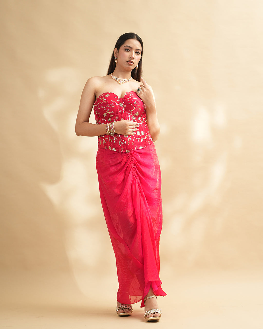 Hot pink embroidered corset gown side profile view