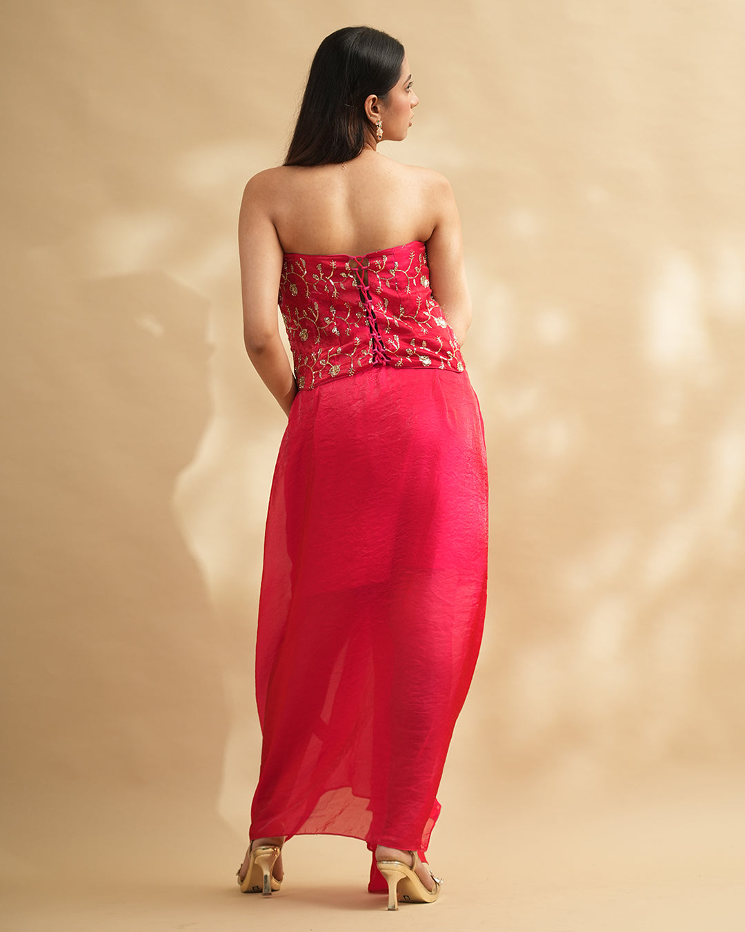 Hot pink draped gown with embellished corset back